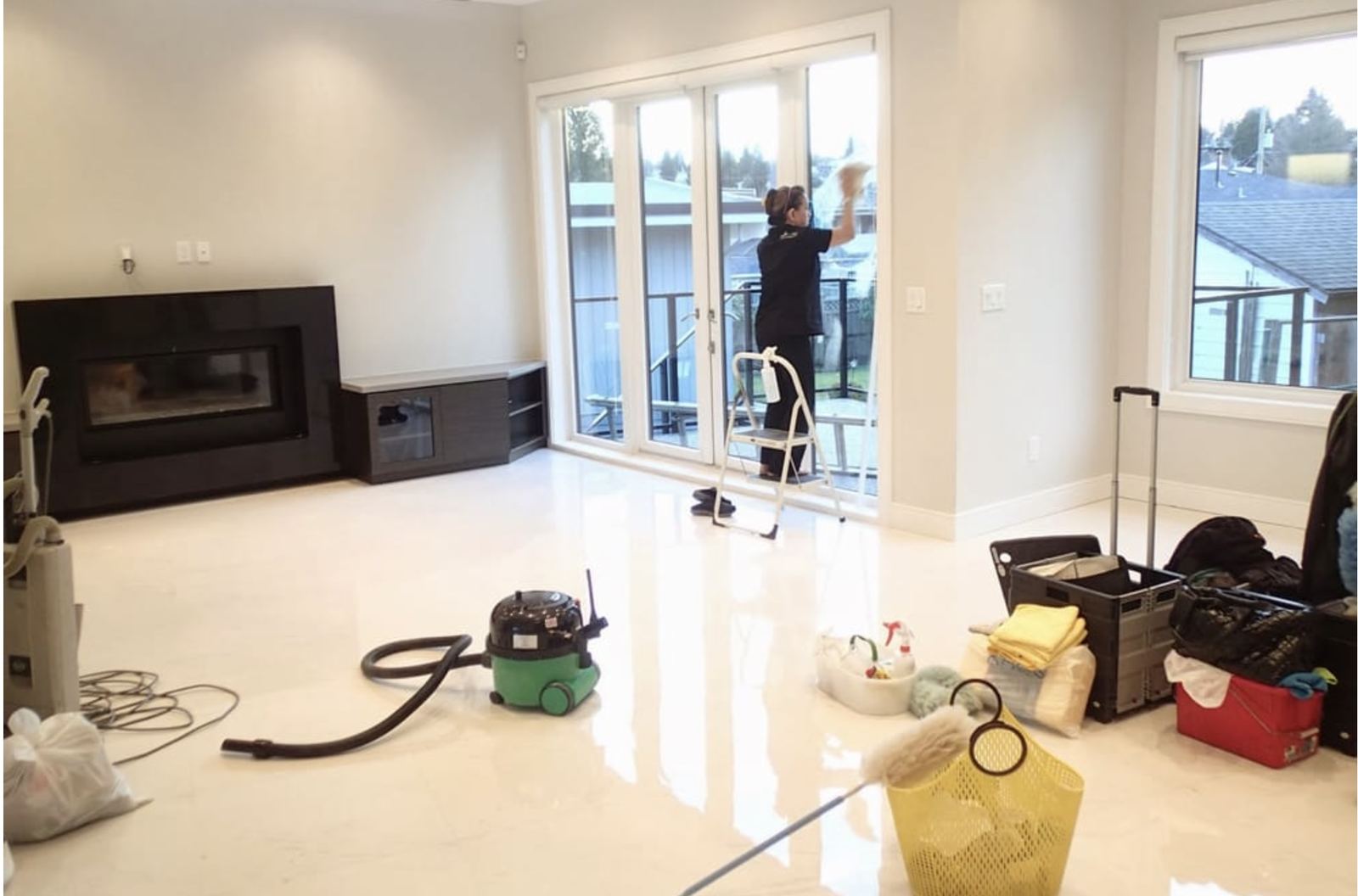 3-B'z crew member cleaning a bright residential interior
